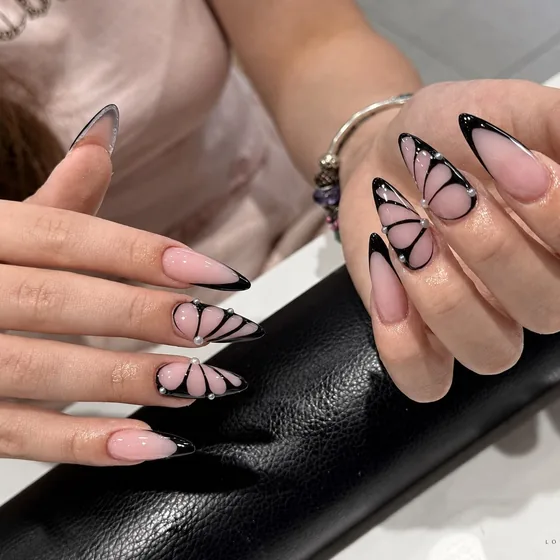 Hand-painted black butterfly nail art